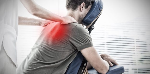 Physiotherapist giving shoulder massage to man against highlighted pain