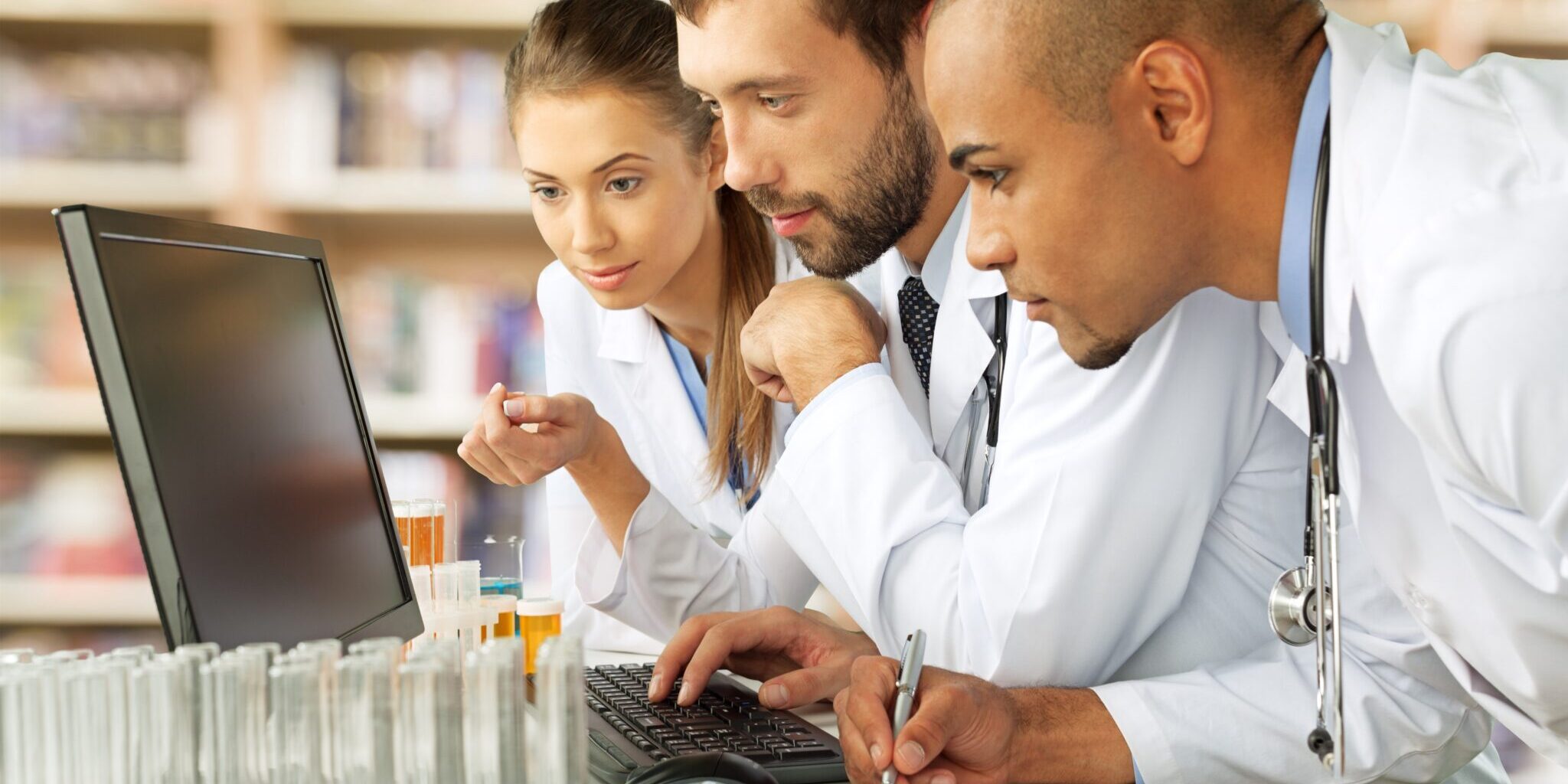 Doctors team talking expertise in hospital and working at the laboratory