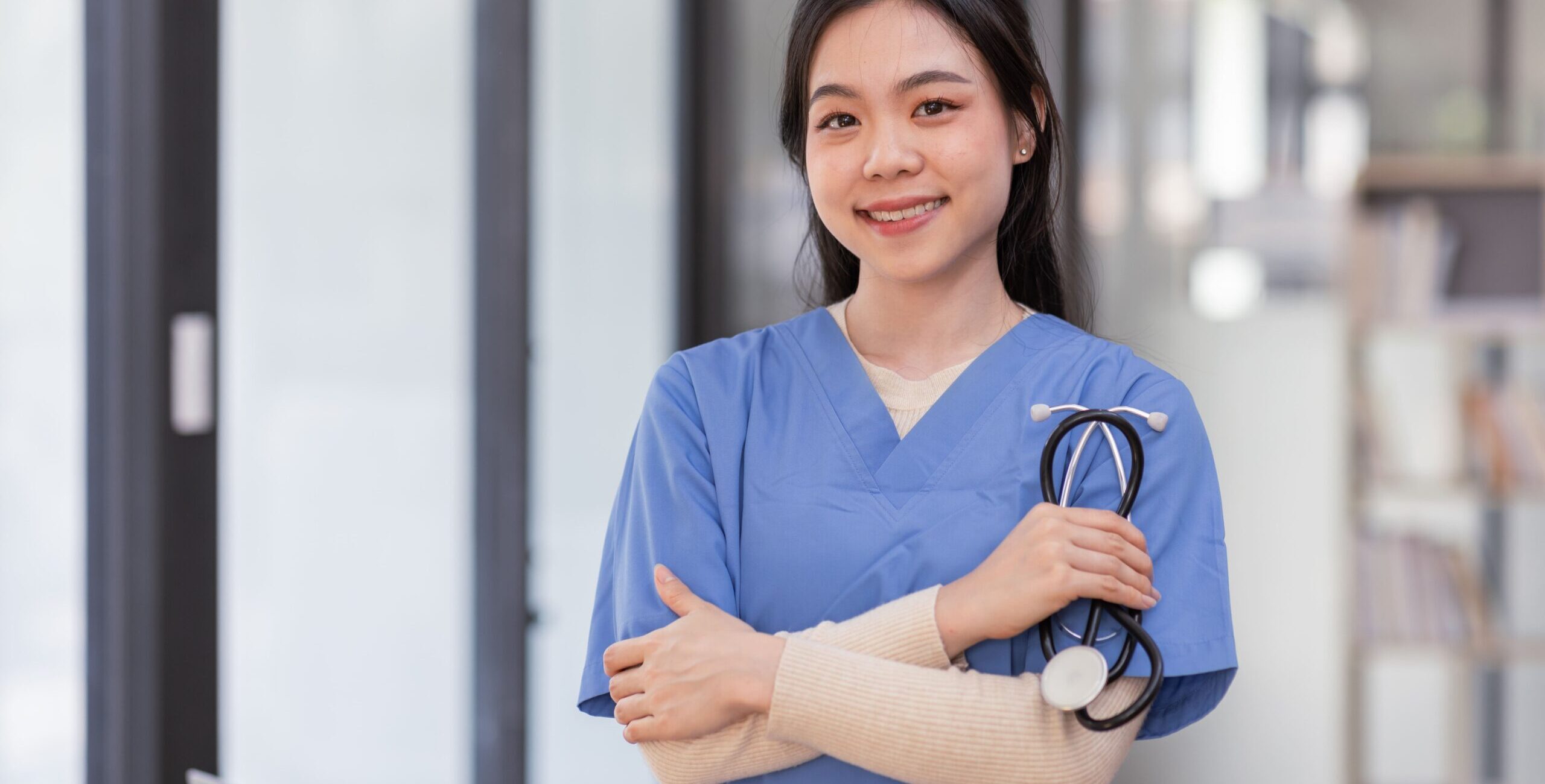 portrait-of-young-asian-smiling-female-nurse-in-ho-2023-11-27-04-51-29-utc (1)