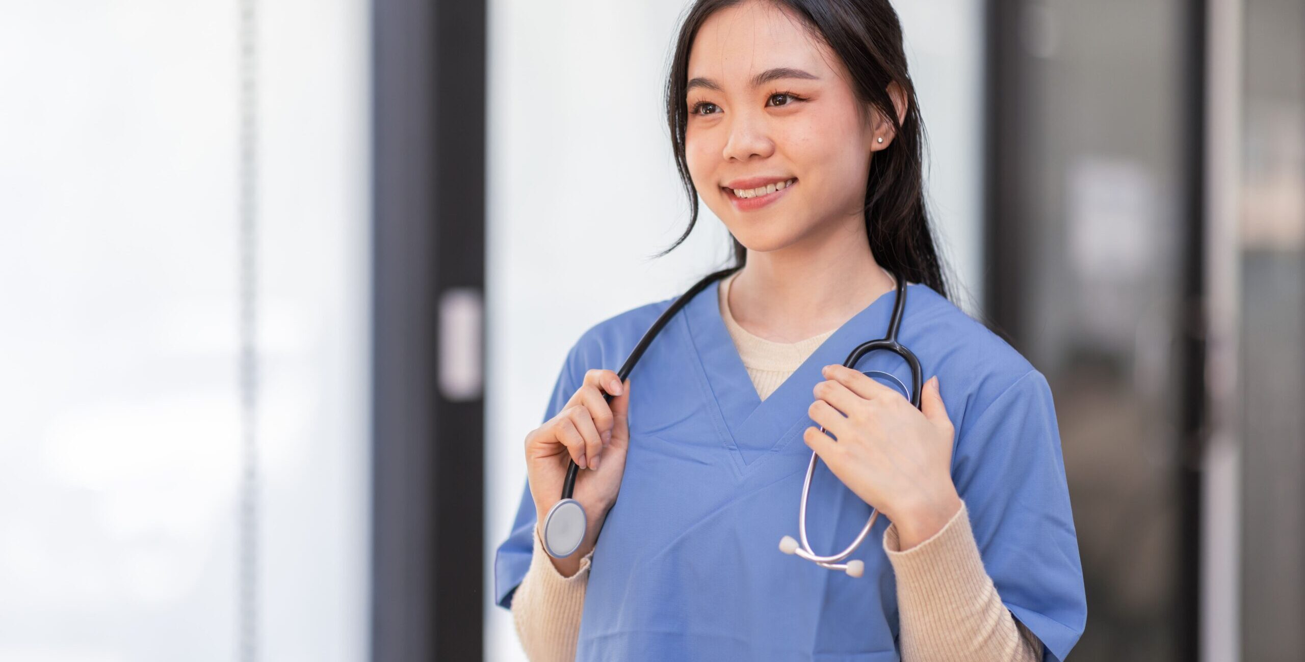 portrait-of-young-asian-smiling-female-nurse-in-ho-2023-11-27-05-10-05-utc (2)