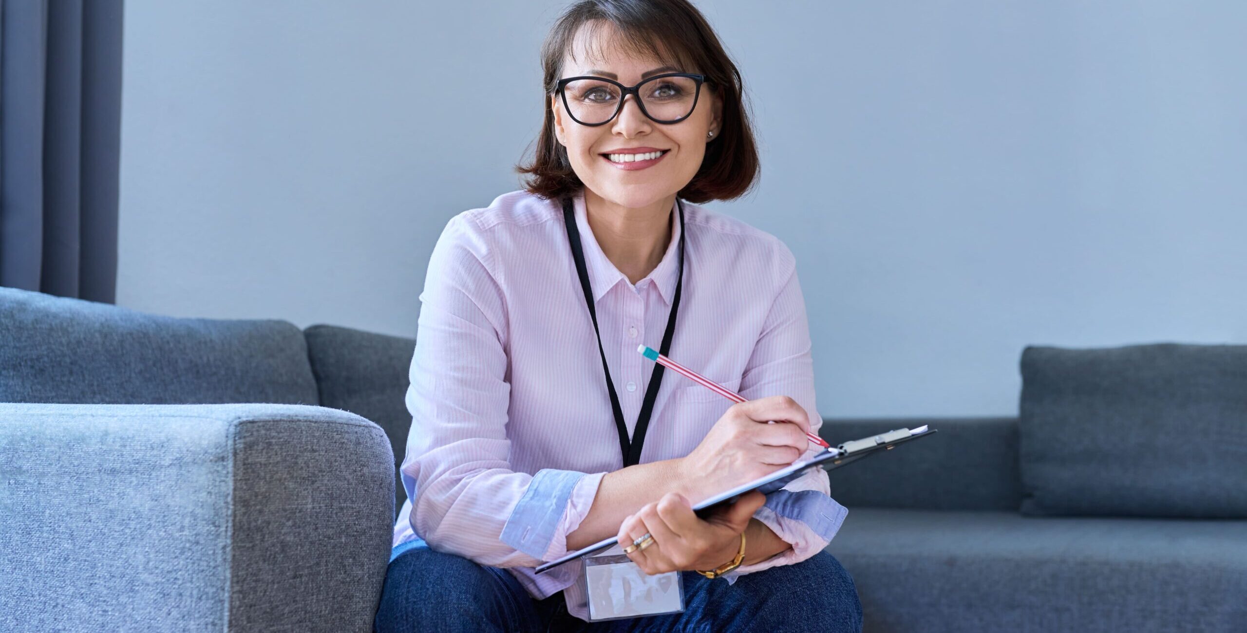 portrait-of-female-psychologist-sitting-on-sofa-in-2023-11-27-05-33-24-utc (1)