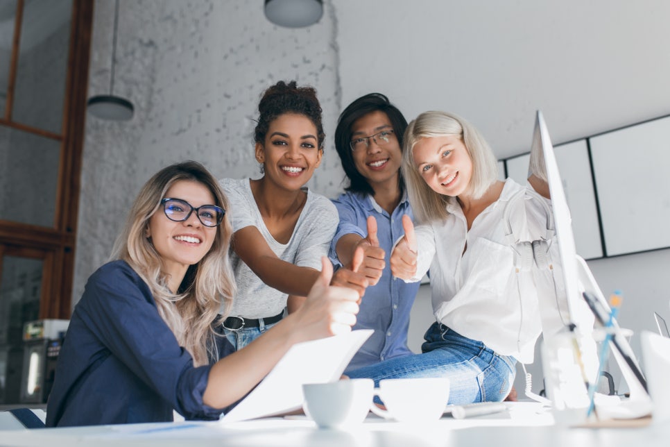 blissful-african-female-head-marketing-department-posing-with-thumb-up-after