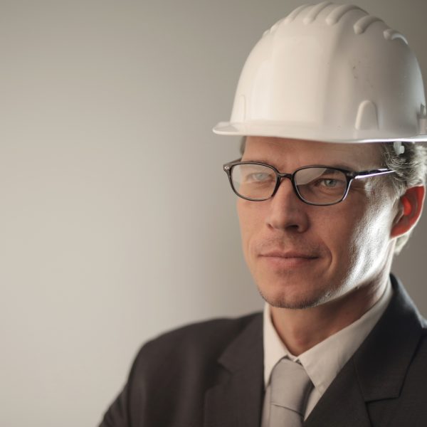 man-in-black-suit-jacket-wearing-hard-hat-3776969